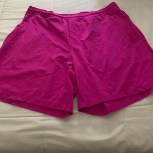 Lululemon 7” dark pink shorts. Men’s L